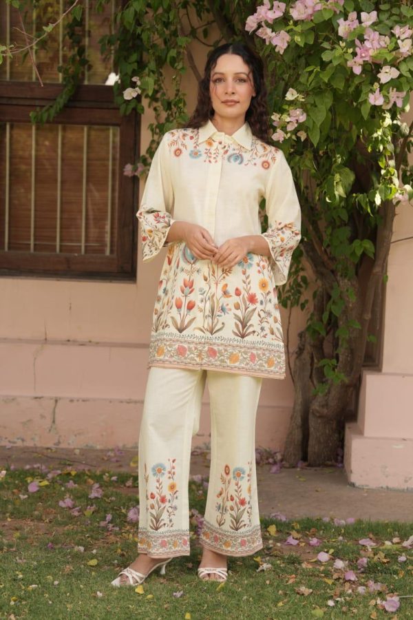 Perfect Fit cream co-ord set with colorful floral embroidery, standing outdoors