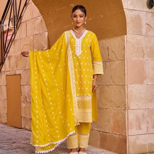Woman wearing a marigold yellow 3-piece cotton kurti set with intricate white embroidery and dupatta – The Elegance Corner